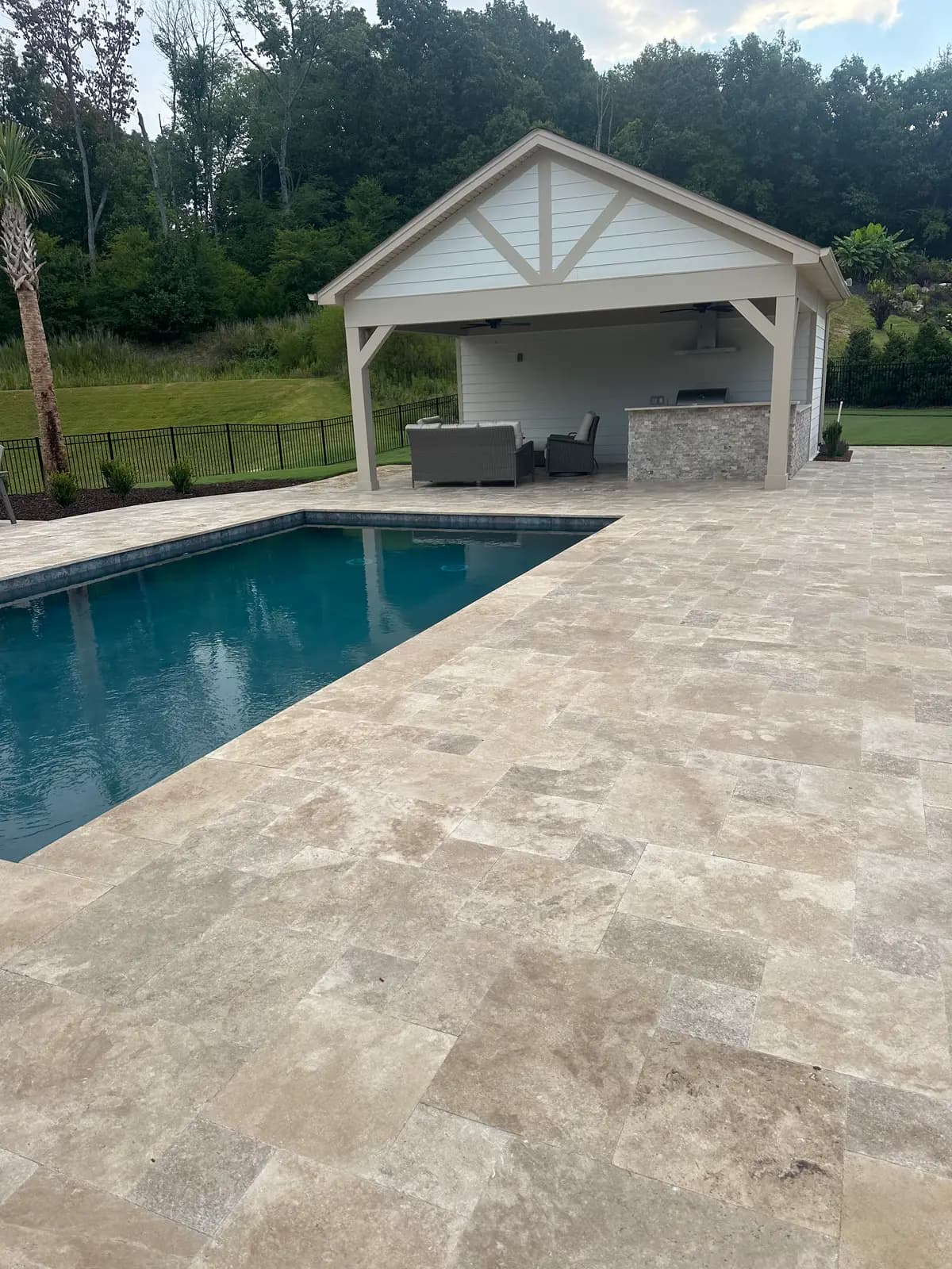 Custom gunite pool with an outdoor kitchen in Huntersville, NC built by Aqua Pools & Outdoor Living