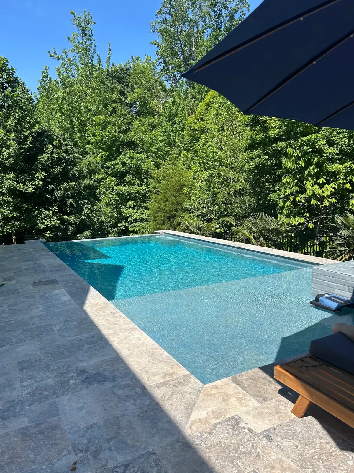 Infinity edge pool with an outdoor kitchen in Davidson, NC, view 4