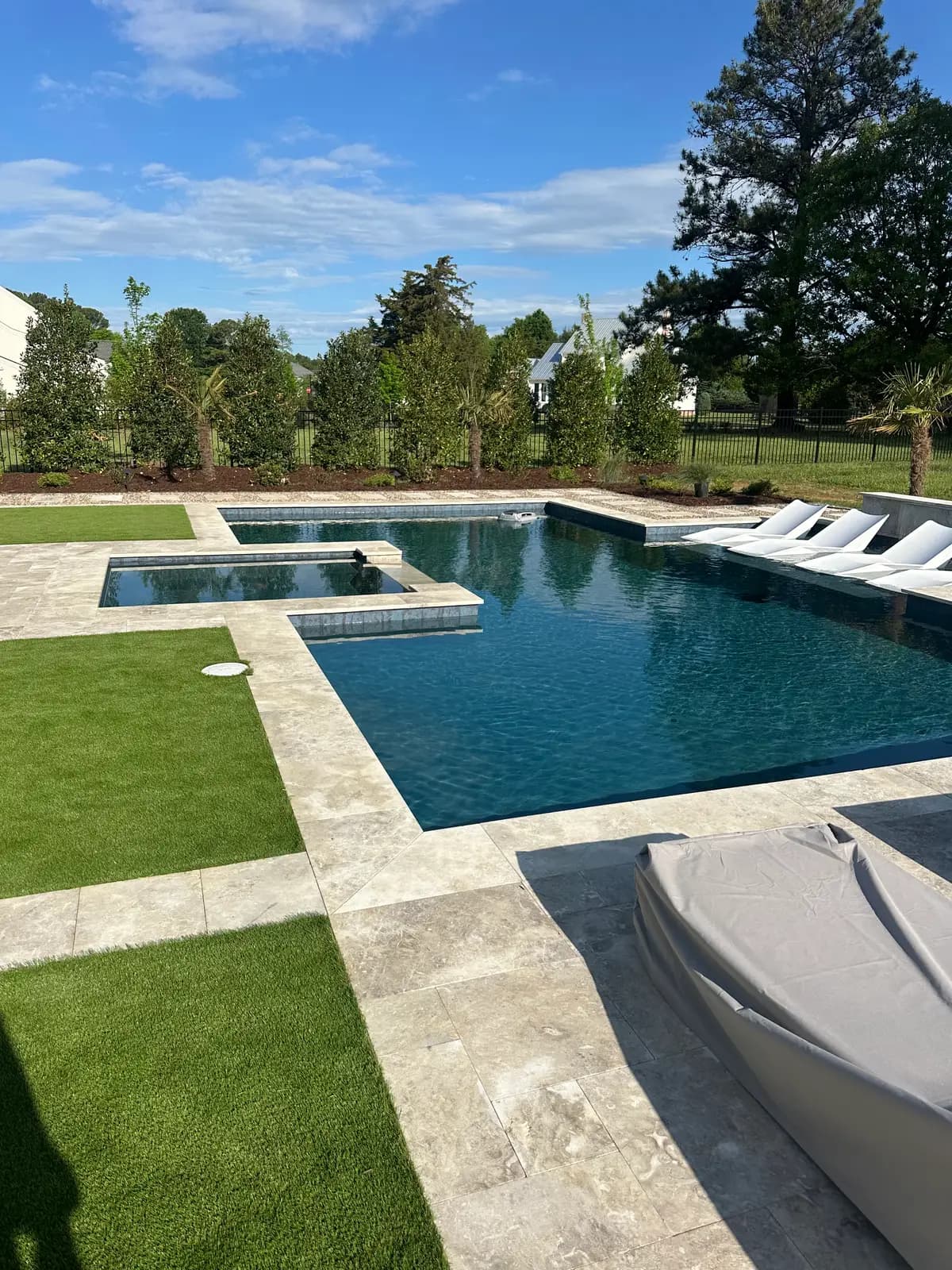 Gunite pool and spa with an outdoor kitchen in Huntersville, NC, view 2