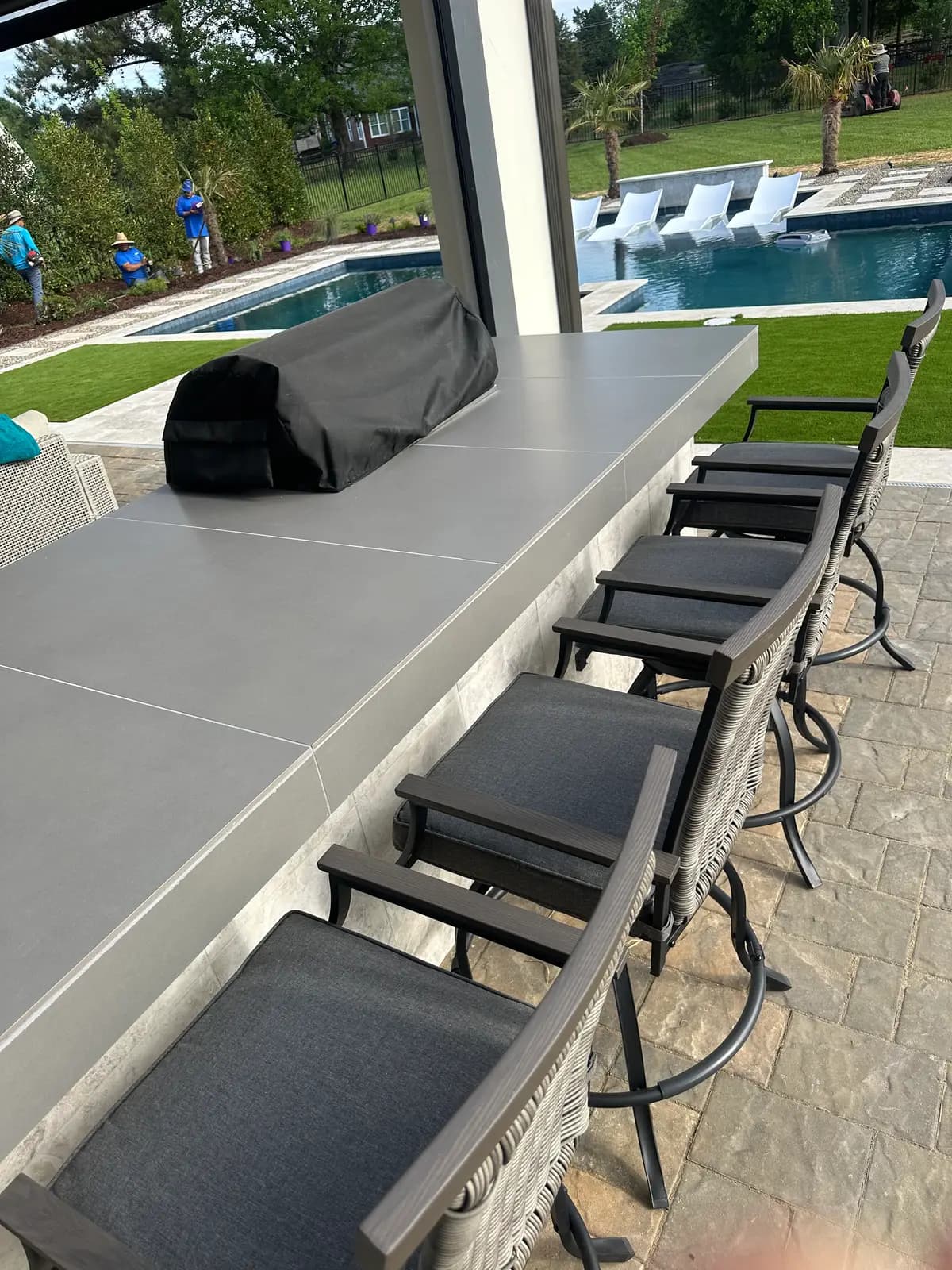 Gunite pool and spa with an outdoor kitchen in Huntersville, NC, view 17