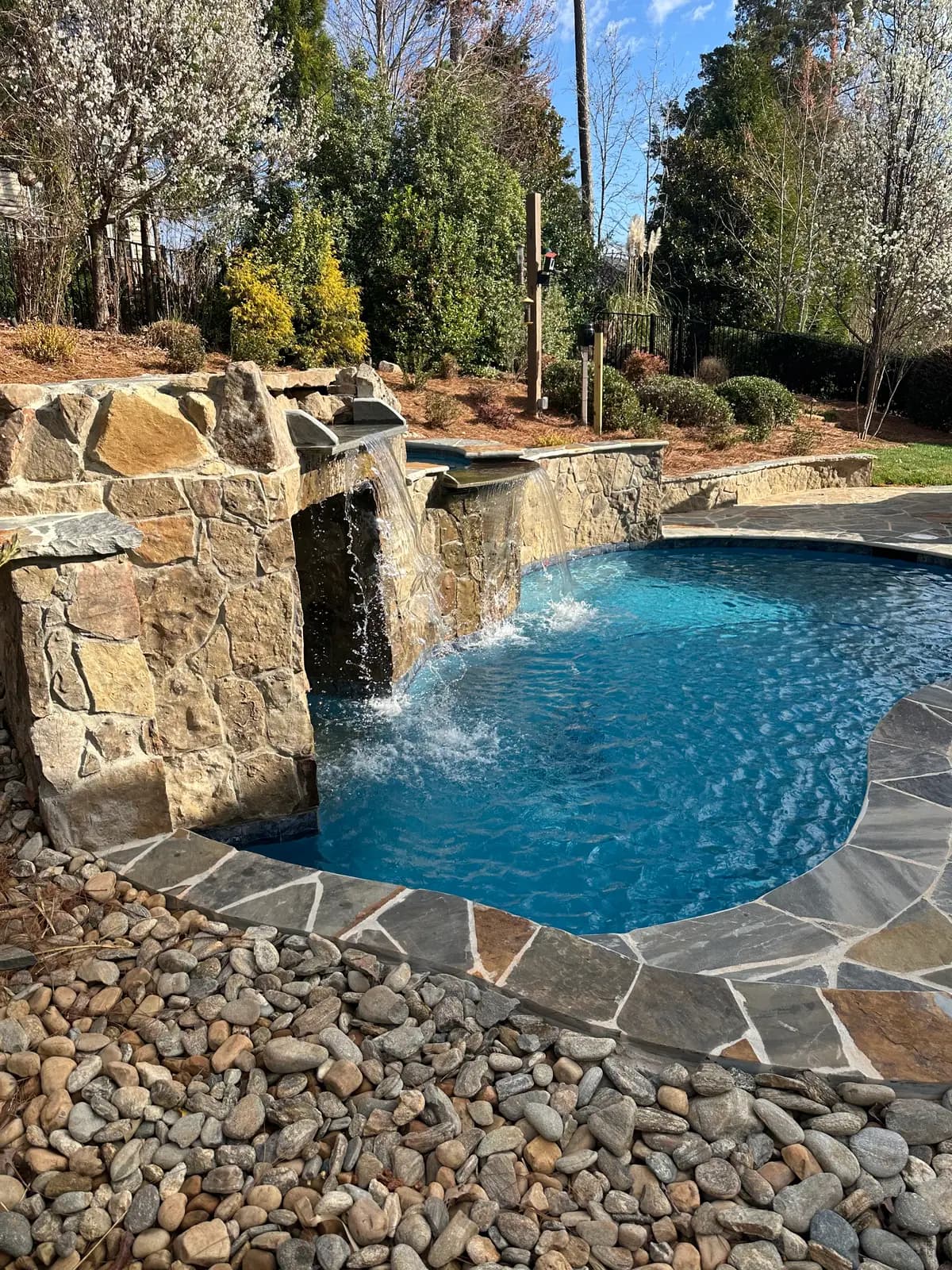 Gunite pool and spa with outdoor lighting in Harrisburg, NC, view 2