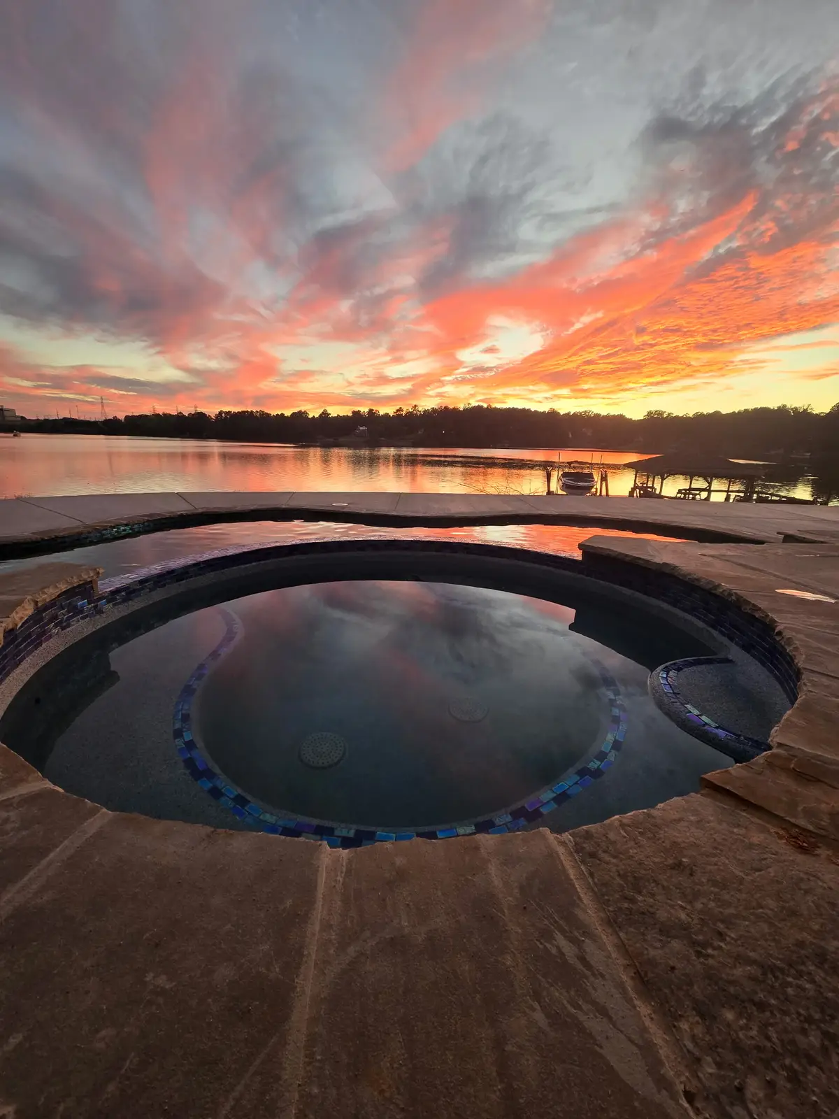 Gunite pool and spa with hardscaping in Lake Wylie, SC built by Aqua Pools & Outdoor Living