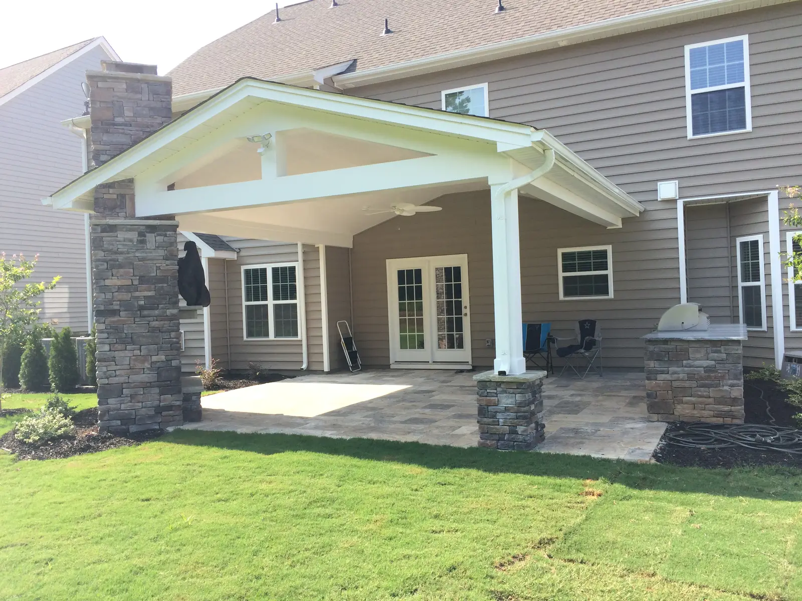 Covered outdoor room with an outdoor kitchen in Waxhaw, NC, view 3