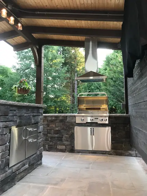 Covered outdoor room with an outdoor kitchen in Charlotte, NC, view 4