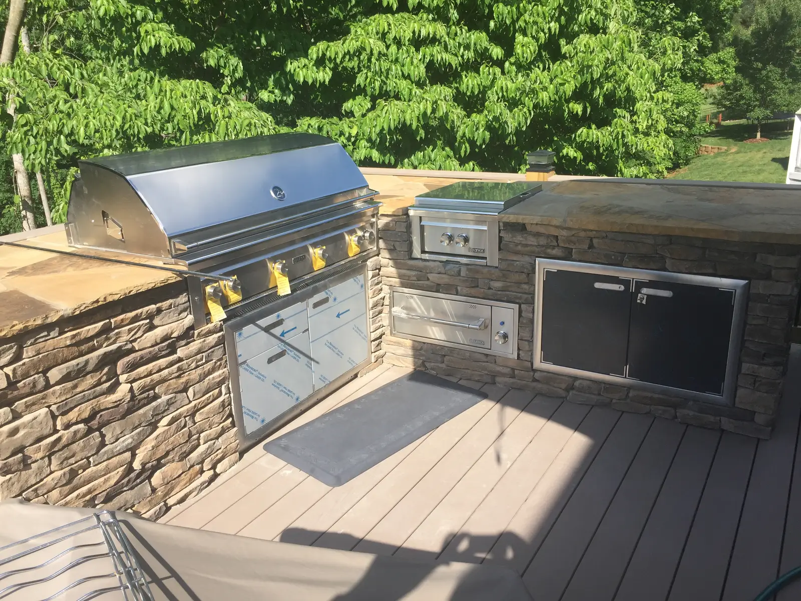 Covered outdoor room with an outdoor kitchen in Charlotte, NC, view 7